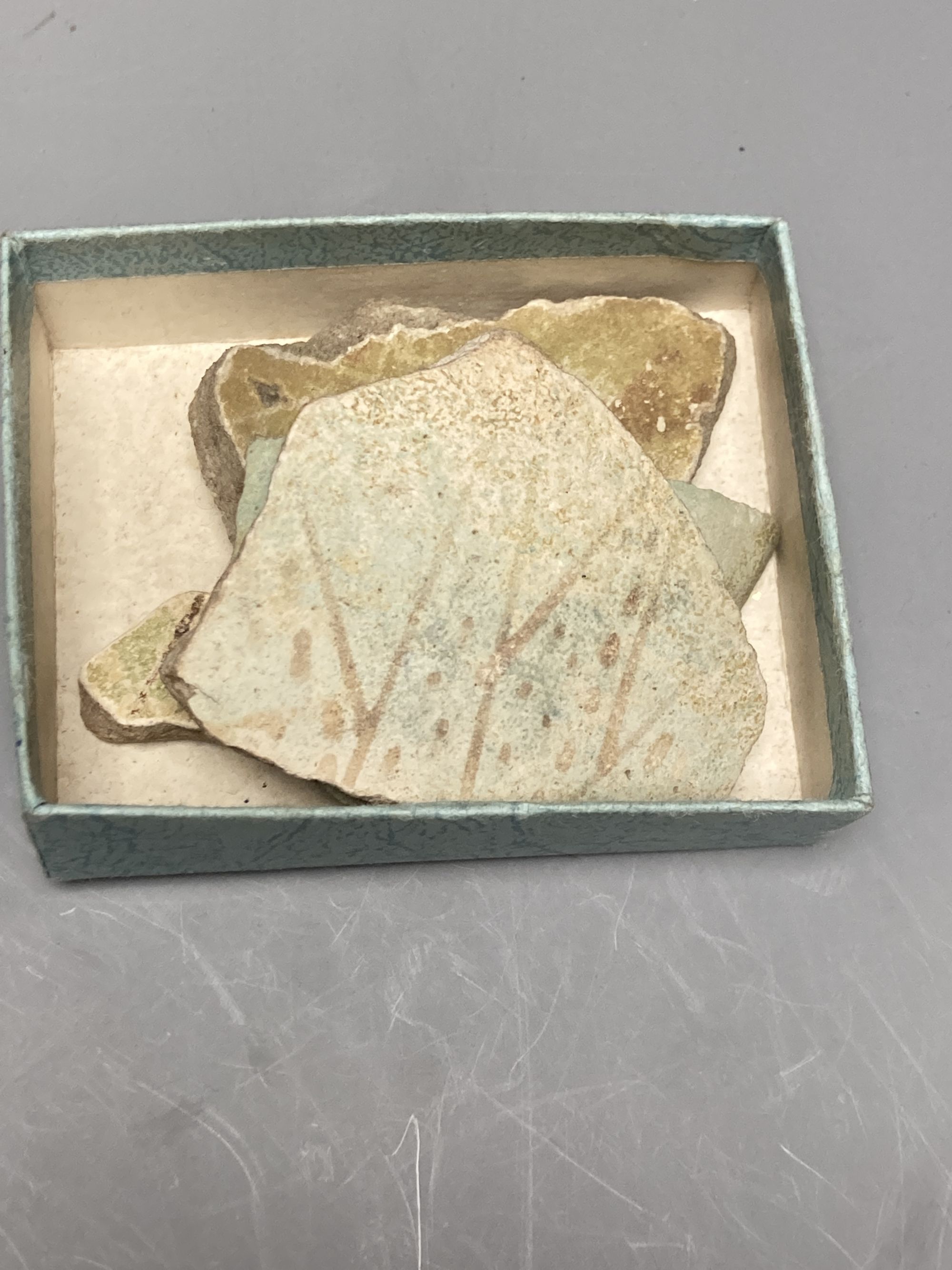 A group of Egyptian pottery fragments, Coptic period, together with a Syrian Islamic pottery oil lamp fragment